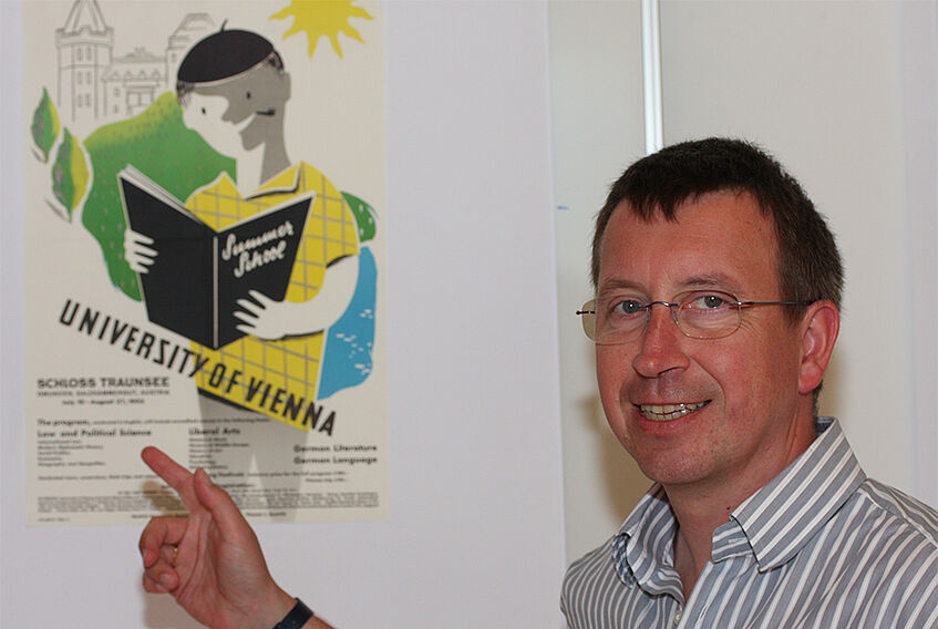 Director Meissel ponting at a poster for one of the first summer programs organized by the SHS