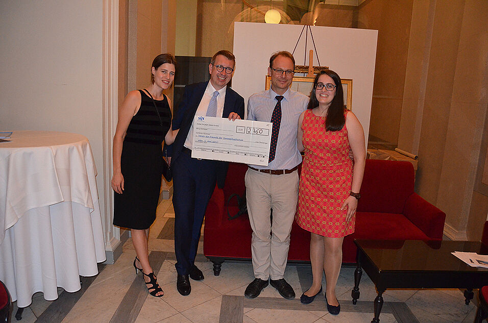 Stephanie Hanel (SHS staff), Franz-Stefan Meissel (Director of the SHS), Dr. Ernest Gnan (General Secretary of the Friends of the Sommerhochschule), and Ana Kumin (SHS staff) with the check for the raised funds