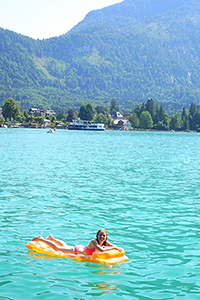 Girl on an air mattress on the lake