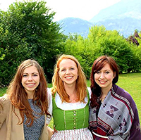 Three Girls in front of green landscape